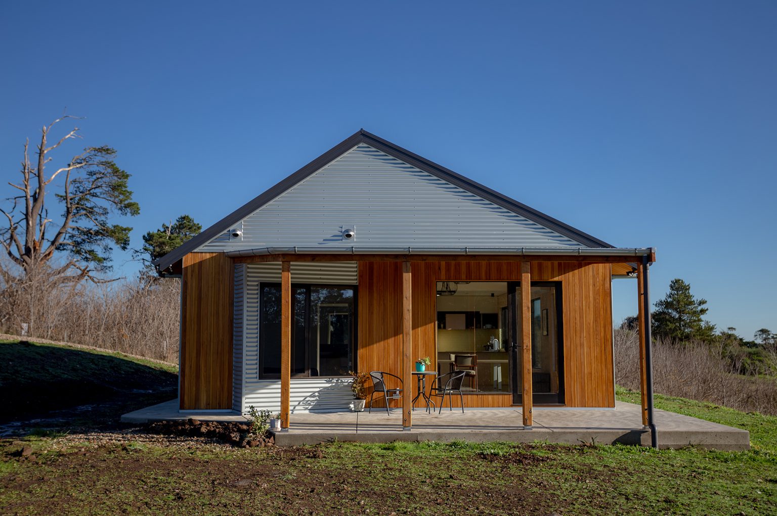 Modern countryside cottage with wooden exterior